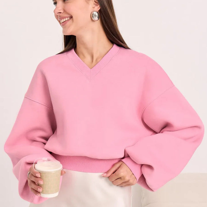 Kvinnors oversized V-hals sweatshirt med voluminösa ärmar Mirla-Eva Jonsson