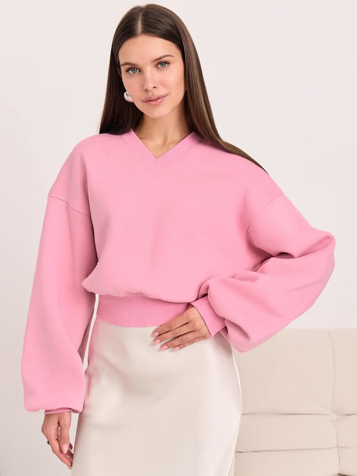 Kvinnors oversized V-hals sweatshirt med voluminösa ärmar Mirla-Eva Jonsson