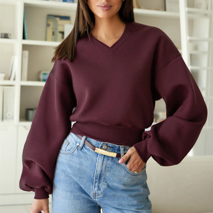 Kvinnors oversized V-hals sweatshirt med voluminösa ärmar Mirla-Eva Jonsson