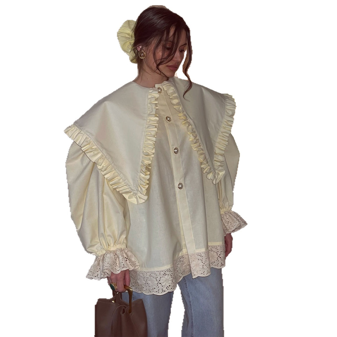 Kvinnors oversized blus med ruffle-detaljer och spetskant Mirla-Eva Jonsson