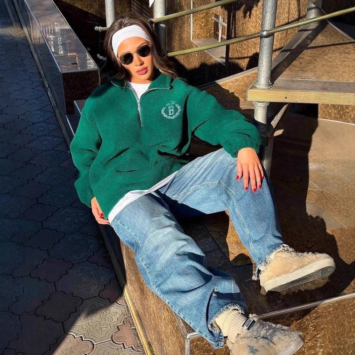 Kvinnors oversized fleece-tröja med dragkedja och broderad logotyp Mirla-Eva Jonsson