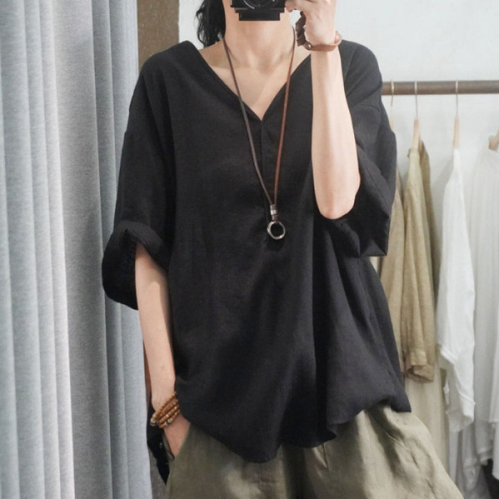 Kvinnors oversized linne T-shirt med V-hals och avslappnad passform Mirla-Eva Jonsson