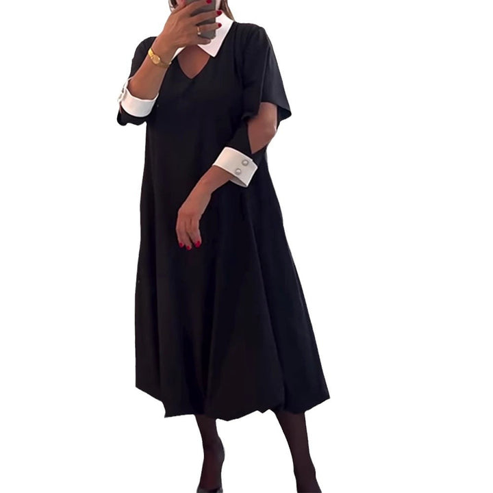Kvinnors oversized skjortklänning med V-ringning och elegant kragstruktur Mirla-Eva Jonsson