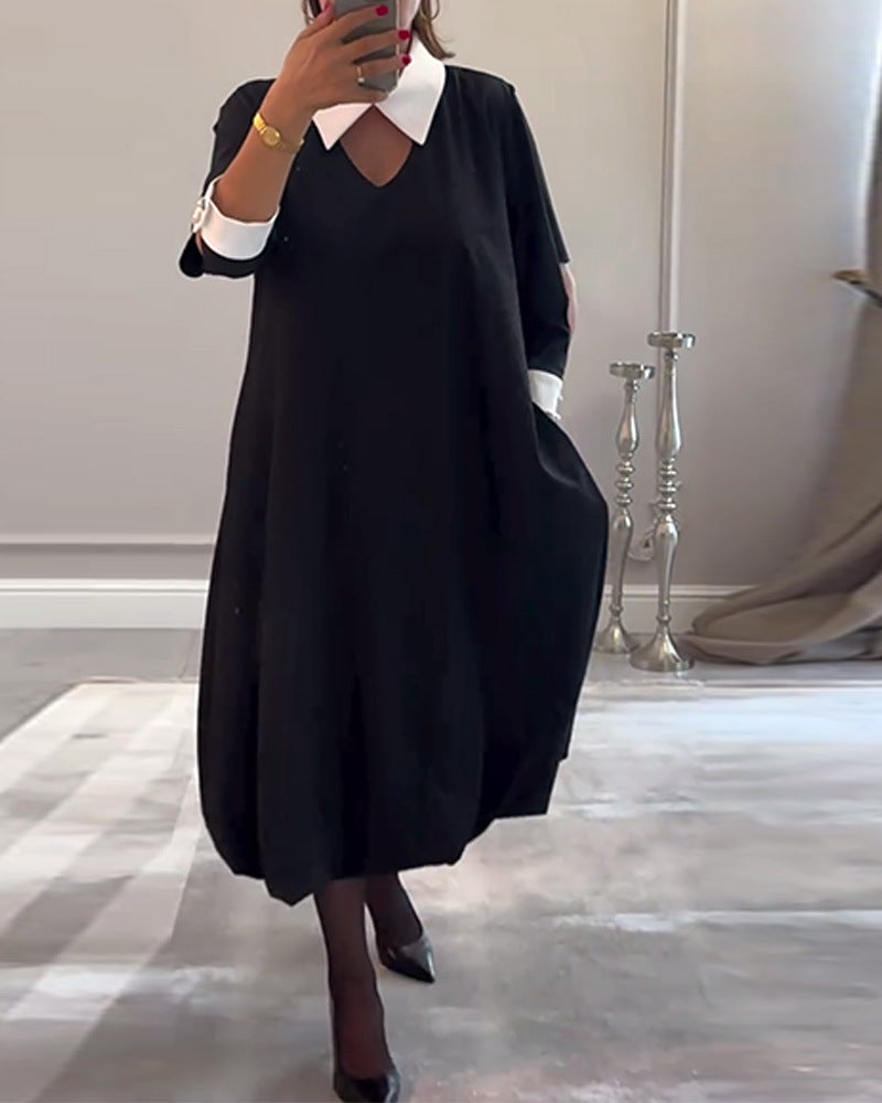 Kvinnors oversized skjortklänning med V-ringning och elegant kragstruktur Mirla-Eva Jonsson