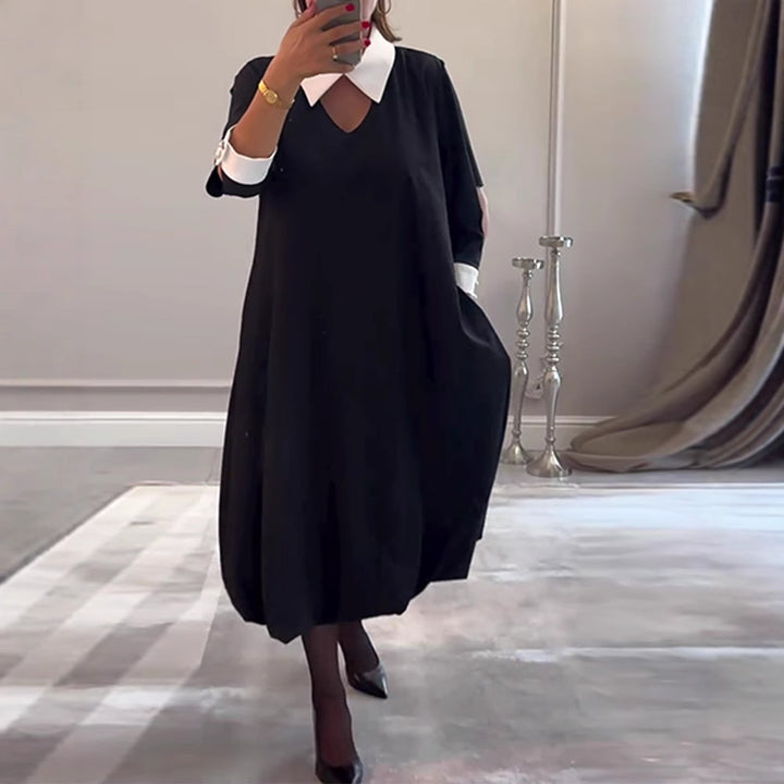 Kvinnors oversized skjortklänning med V-ringning och elegant kragstruktur Mirla-Eva Jonsson