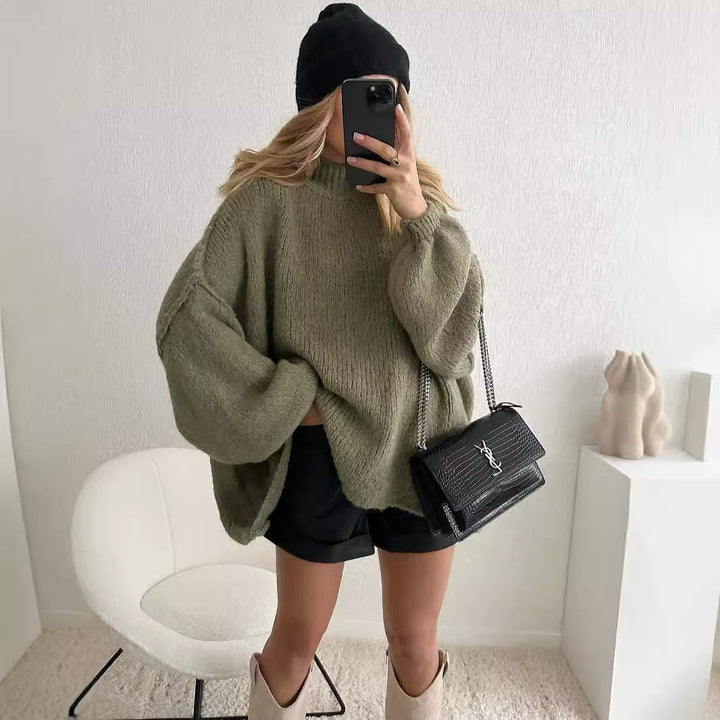 Kvinnors oversized stickad tröja med voluminösa ärmar och mjukt material Mirla-Eva Jonsson