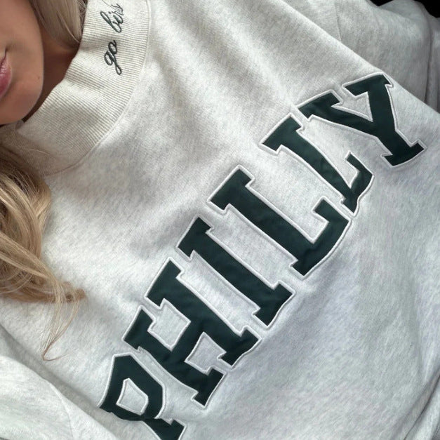 Kvinnors oversized sweatshirt med trendiga bokstäver Mirla-Eva Jonsson
