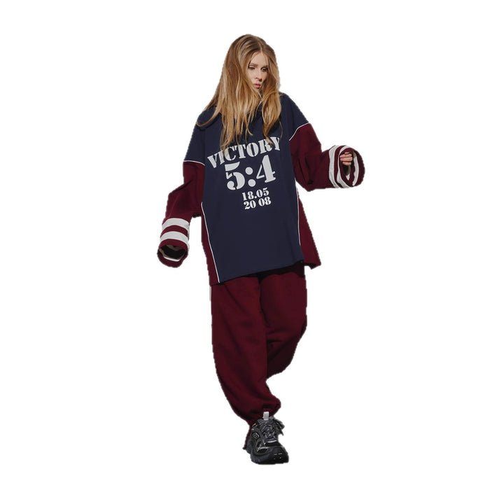 Kvinnors oversized träningsdräkt med grafiskt tryck och vida byxor Mirla-Eva Jonsson