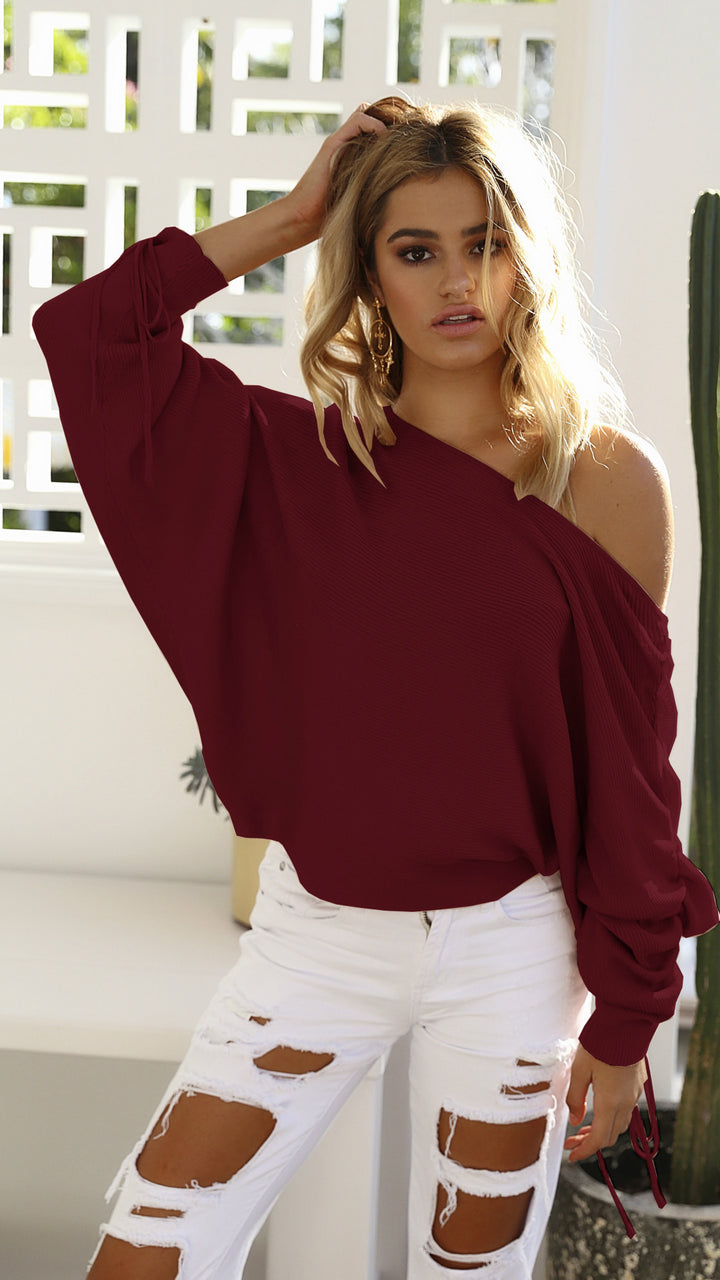 Kvinnors oversized tröja med asymmetrisk skärning och avslappnade detaljer Mirla-Eva Jonsson
