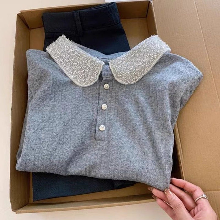 Kvinnors polo topp med elegant krage Mirla-Eva Jonsson