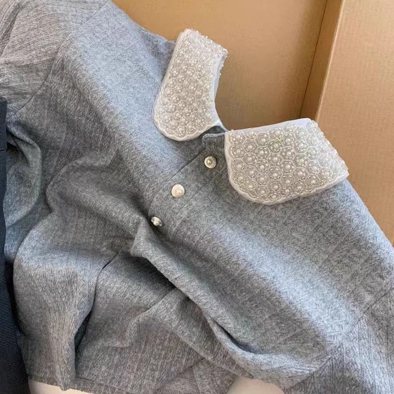 Kvinnors polo topp med elegant krage Mirla-Eva Jonsson