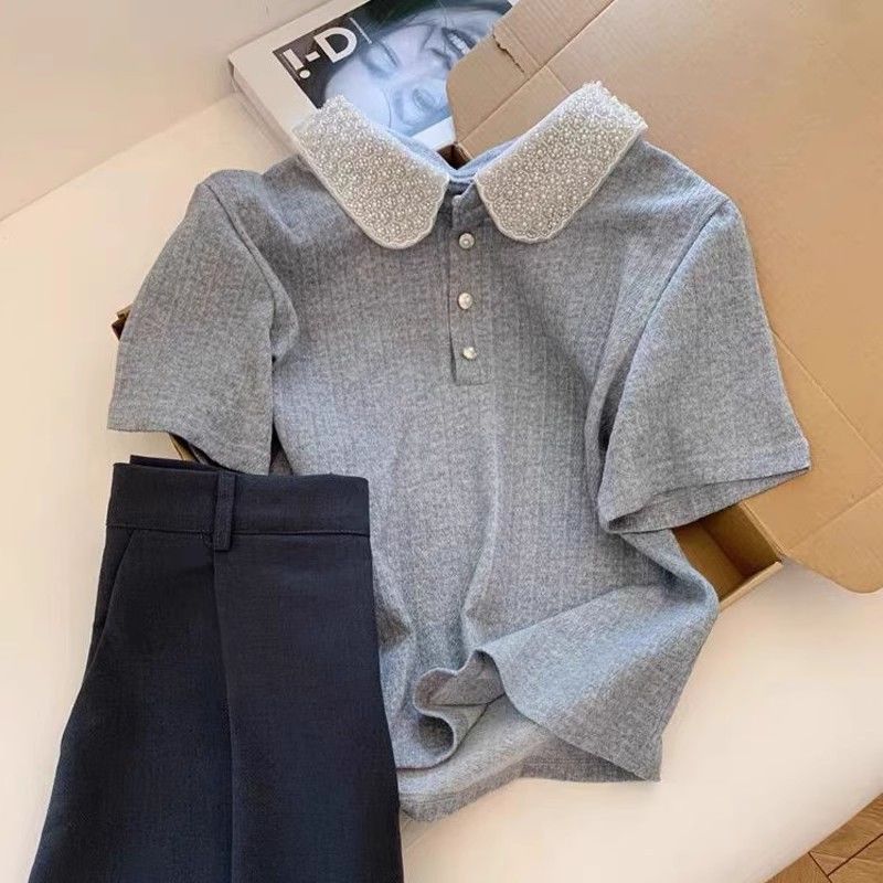 Kvinnors polo topp med elegant krage Mirla-Eva Jonsson