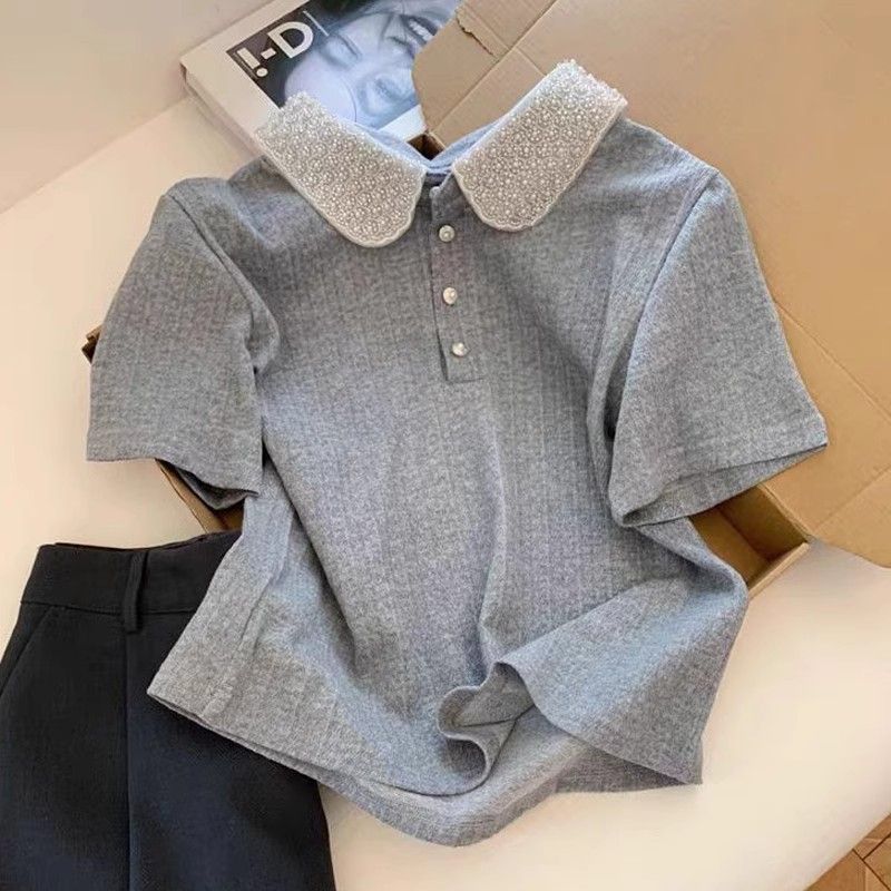 Kvinnors polo topp med elegant krage Mirla-Eva Jonsson