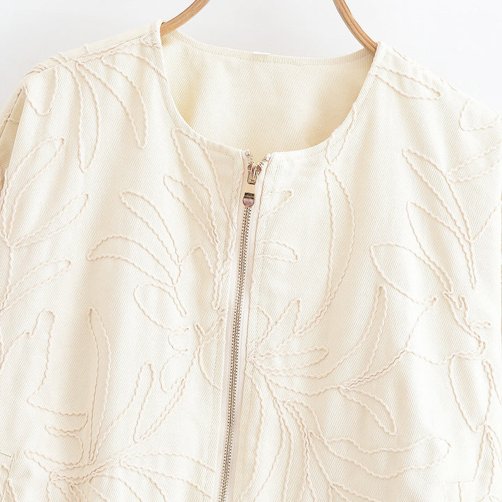 Kvinnors quiltad topp med blommig broderi Mirla-Eva Jonsson
