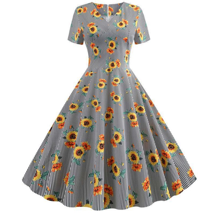 Kvinnors retro svängklänning med blommigt solrosmönster och skräddarsydd passform Mirla-Eva Jonsson