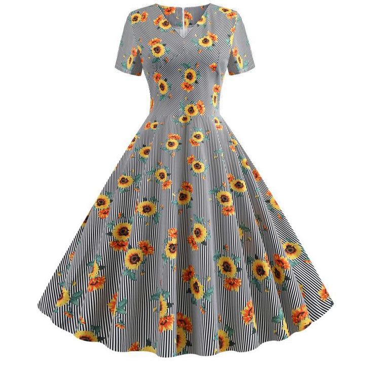 Kvinnors retro svängklänning med blommigt solrosmönster och skräddarsydd passform Mirla-Eva Jonsson