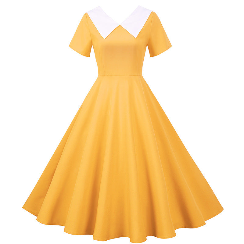 Kvinnors retro svängklänning med elegant krage och utsvängd kjol Mirla-Eva Jonsson