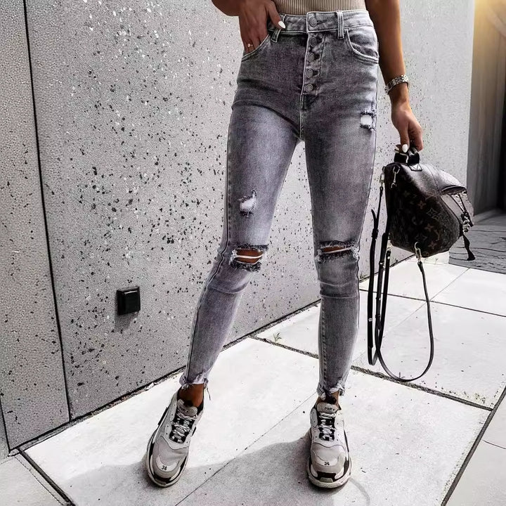 Kvinnors smaljeans med höga fickor och trendiga slitna detaljer Mirla-Eva Jonsson