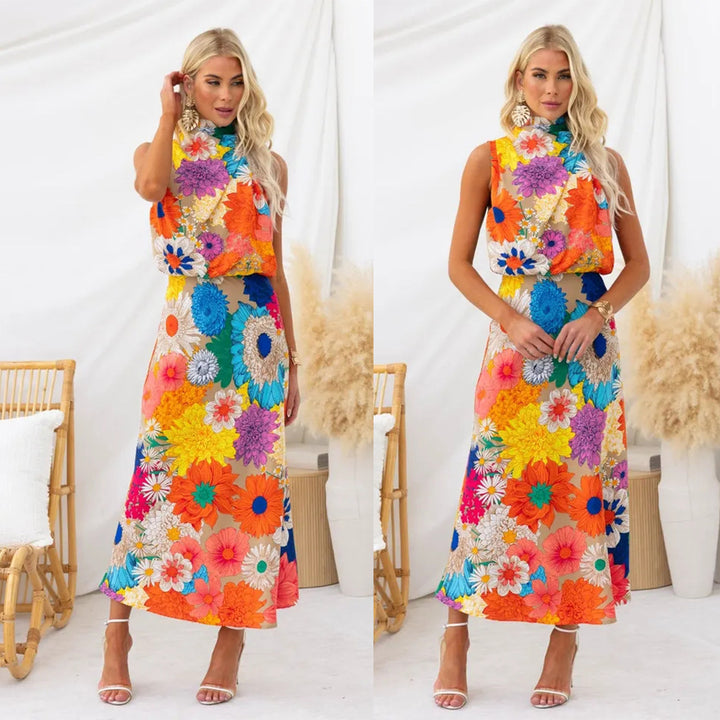 Kvinnors sommar maxiklänning med blommiga accenter och elegant snitt-Eva Jonsson
