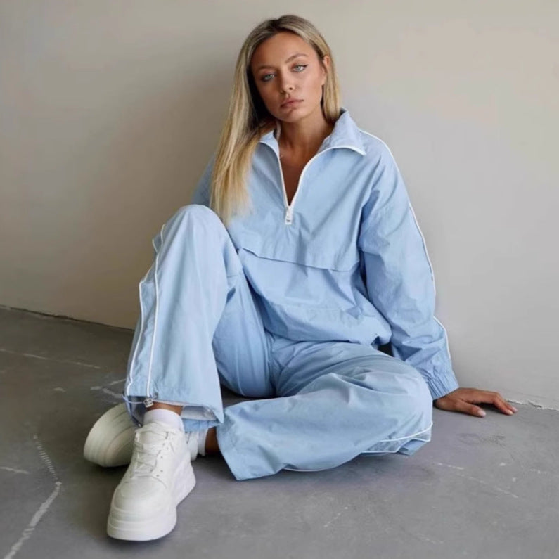 Kvinnors sportig vindjacka med halv dragkedja och elastisk ärm Mirla-Eva Jonsson