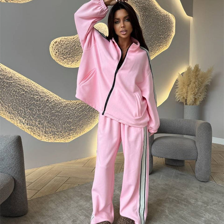Kvinnors sportiga fleece joggingset med hög sidoklyvning Mirla-Eva Jonsson
