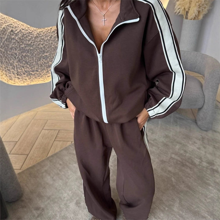 Kvinnors sportiga fleece joggingset med hög sidoklyvning Mirla-Eva Jonsson