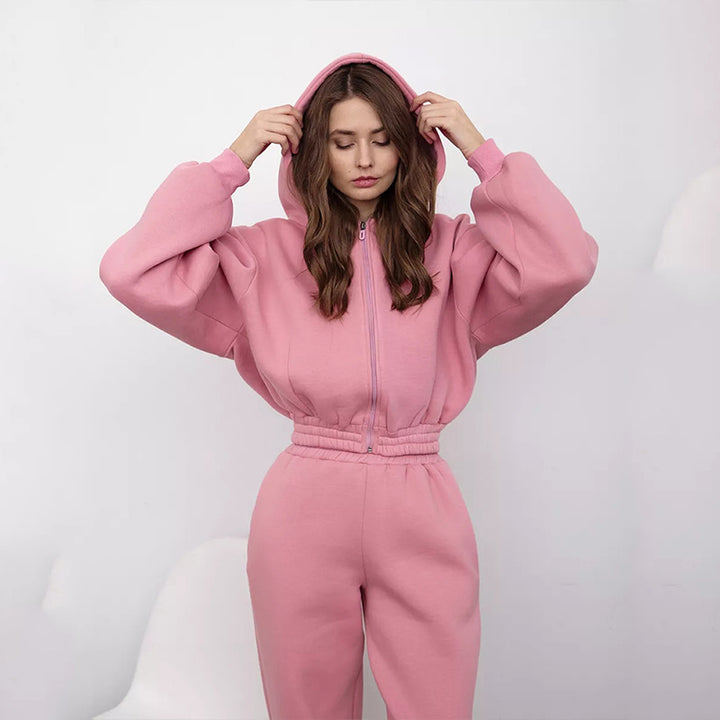 Kvinnors sportiga fleece jumpsuit med huva och lös passform Mirla-Eva Jonsson