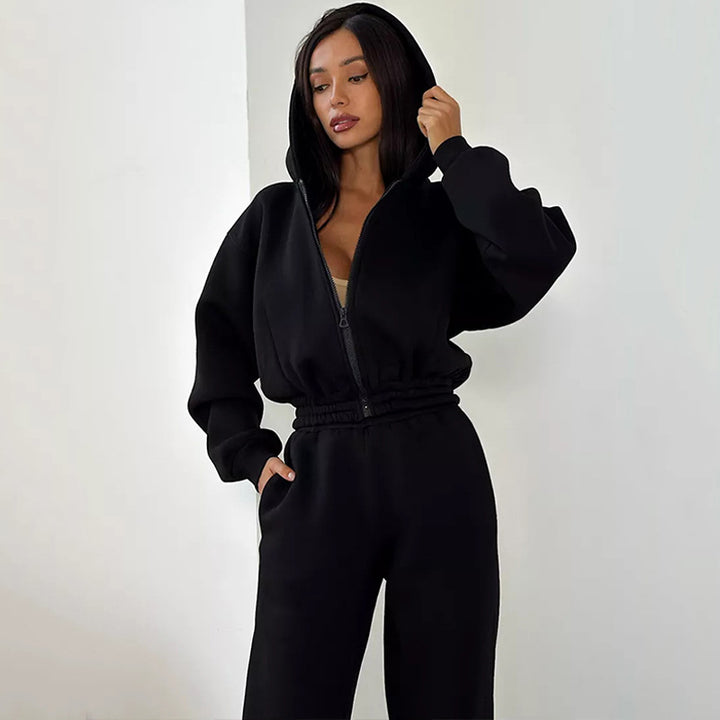 Kvinnors sportiga fleece jumpsuit med huva och lös passform Mirla-Eva Jonsson