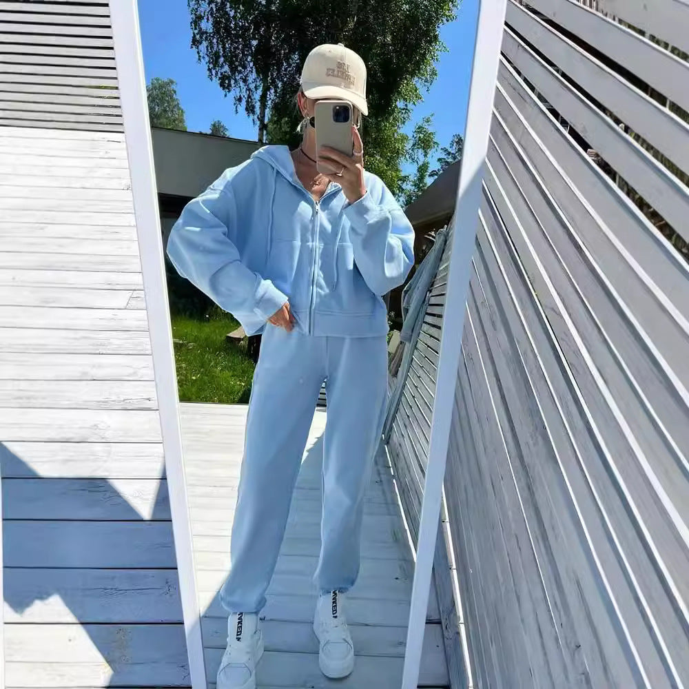 Kvinnors sportiga fleece-träningsdräkt med dragkedja och huva Mirla-Eva Jonsson