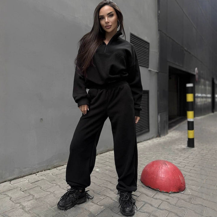 Kvinnors sportiga fleece träningsdräkt med ståkrage och dragkedja Mirla-Eva Jonsson