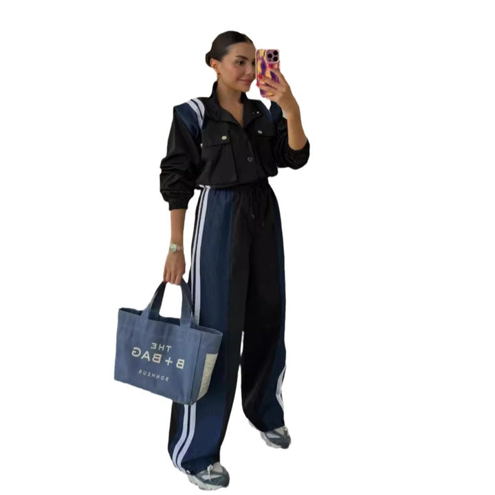 Kvinnors sportiga jumpsuit med sofistikerad dragsko midja och kontrasterande ränder Mirla-Eva Jonsson