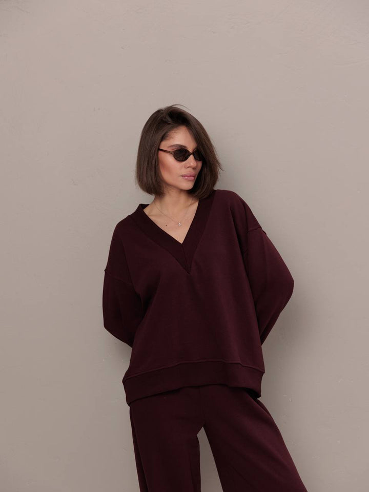 Kvinnors sportiga oversized sweatshirt med V-hals och långa ärmar Mirla-Eva Jonsson