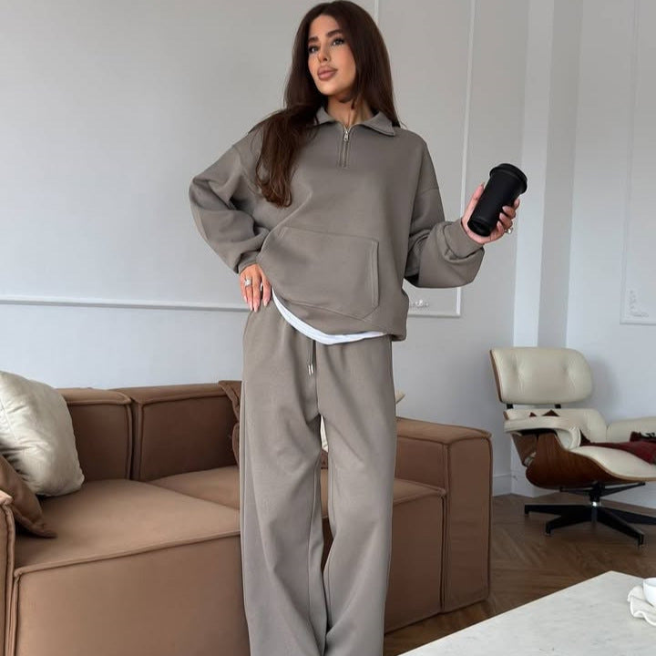 Kvinnors sportiga pullover med halv dragkedja och vida byxor Mirla-Eva Jonsson