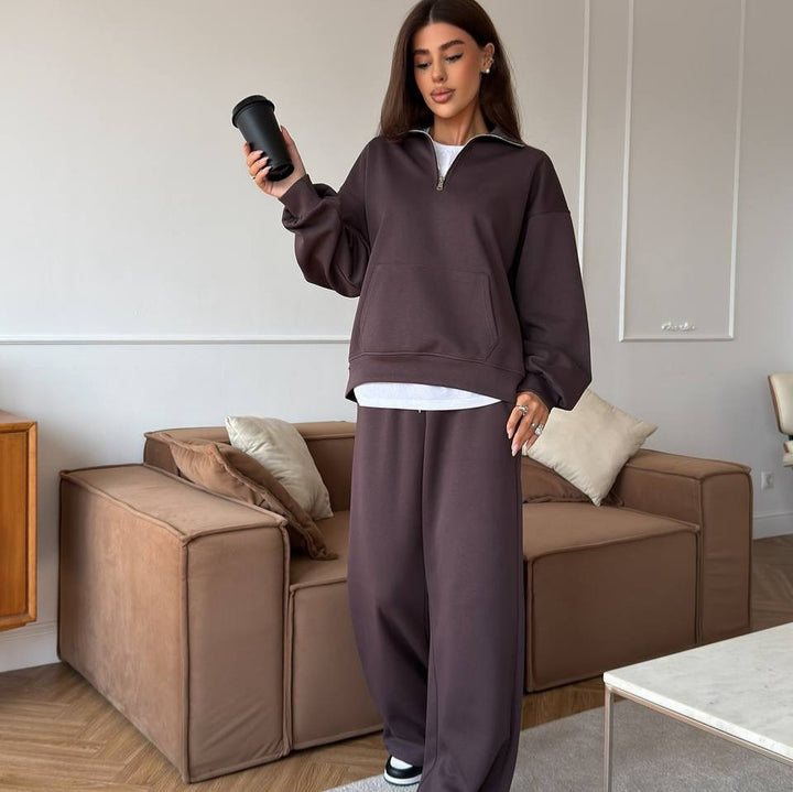 Kvinnors sportiga pullover med halv dragkedja och vida byxor Mirla-Eva Jonsson
