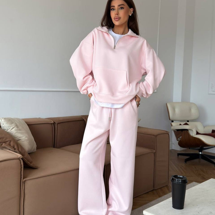 Kvinnors sportiga pullover med halv dragkedja och vida byxor Mirla-Eva Jonsson