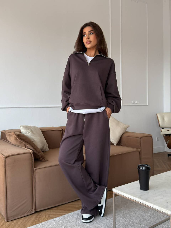 Kvinnors sportiga pullover med halv dragkedja och vida byxor Mirla-Eva Jonsson