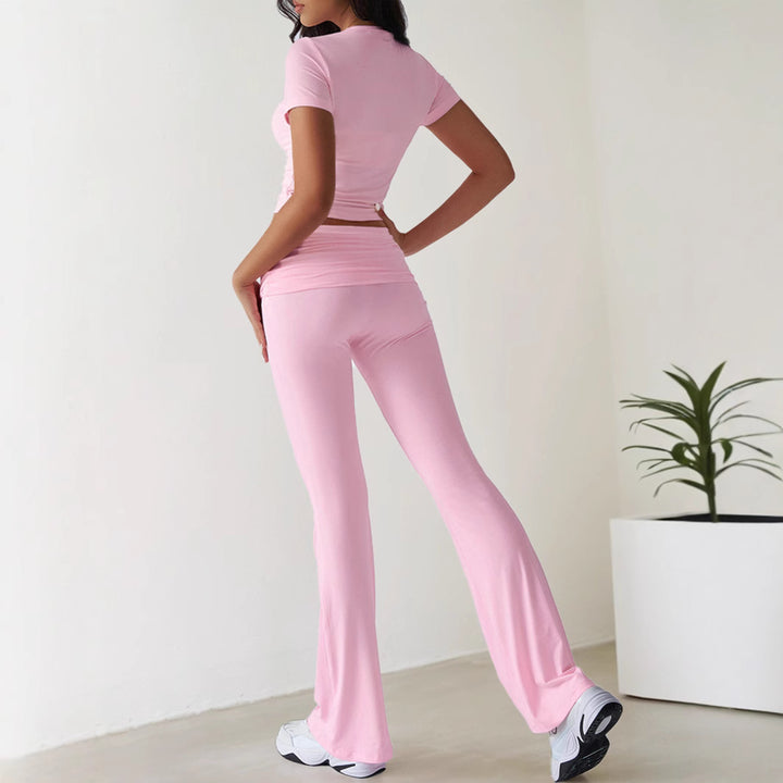 Kvinnors sportiga set med figurnära topp och utsvängda leggings Mirla-Eva Jonsson
