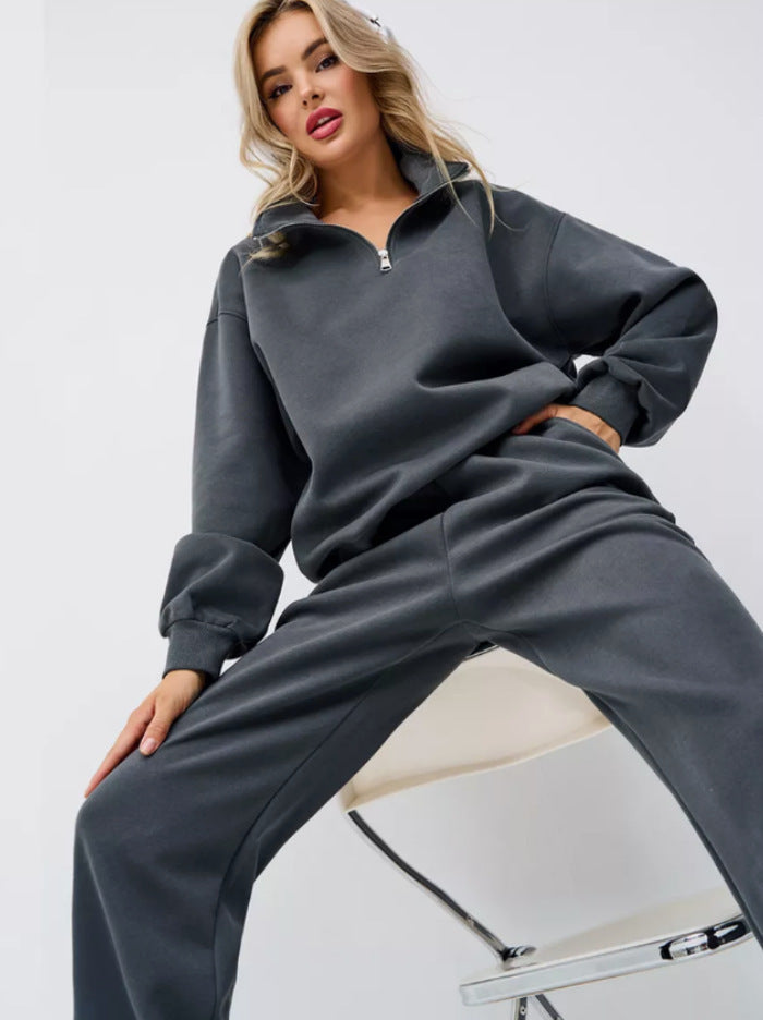 Kvinnors sportiga sweatsuit med halv dragkedja och vida byxor Mirla-Eva Jonsson