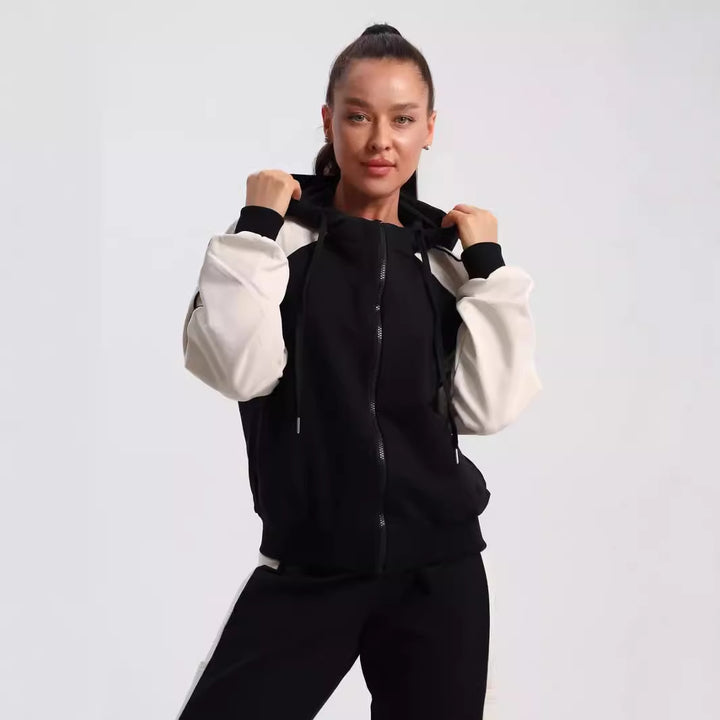 Kvinnors sportiga träningsoverall med funktionell dragkedja och kontrasterande detaljer Mirla-Eva Jonsson