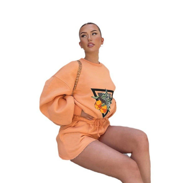 Kvinnors sportiga tröja och shorts set med fruktig design Mirla-Eva Jonsson