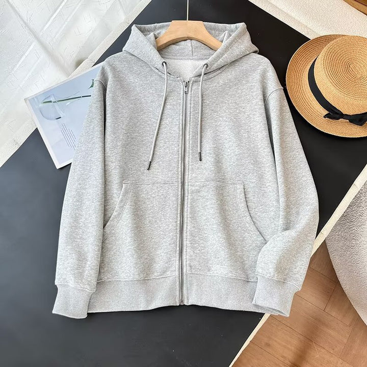 Kvinnors sportiga zip hoodie med praktiska kängurufickor Mirla-Eva Jonsson