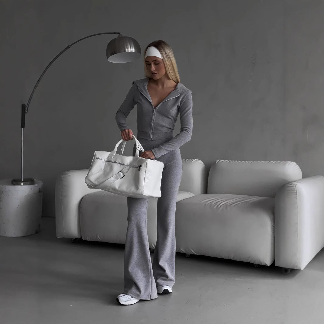 Kvinnors sportiga zip hoodie-set med en figurnära passform och elastisk midja Mirla-Eva Jonsson