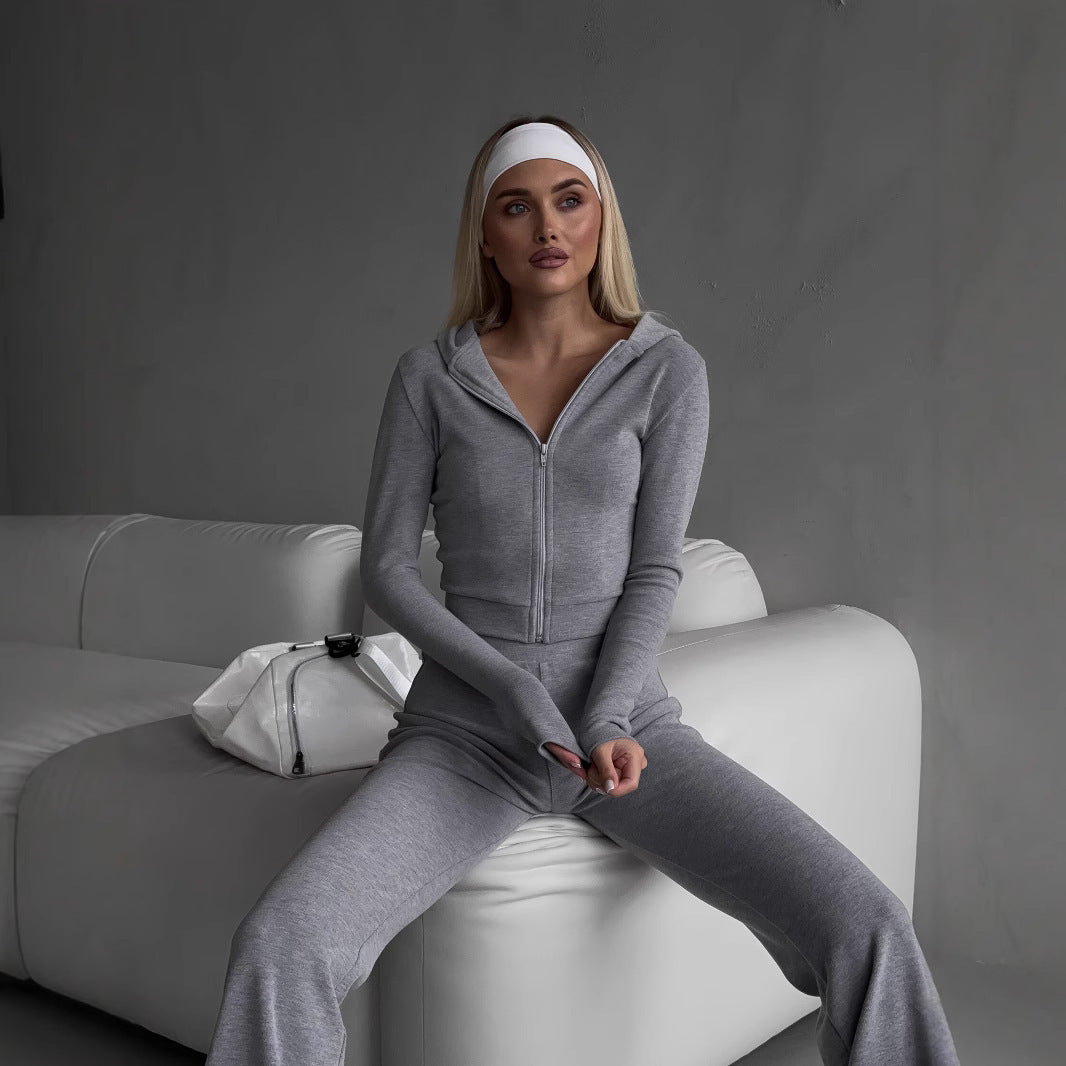 Kvinnors sportiga zip hoodie-set med en figurnära passform och elastisk midja Mirla-Eva Jonsson