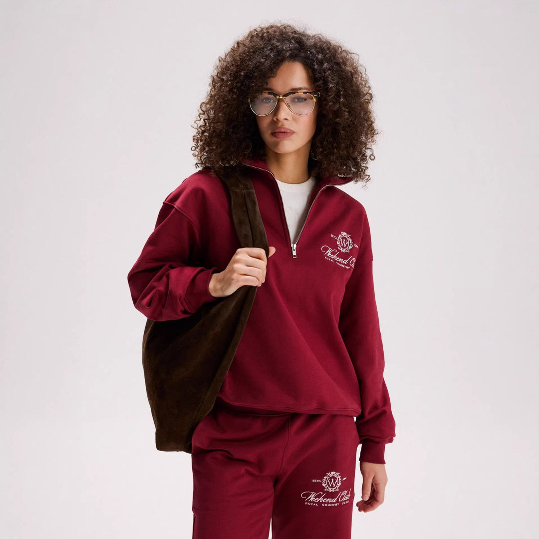 Kvinnors sportiga zip-tröja med en avslappnad passform och elegant broderi Mirla-Eva Jonsson