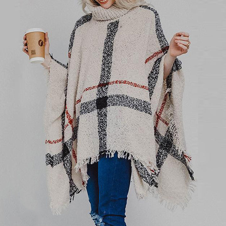 Kvinnors stickad poncho med asymmetrisk skärning och moderiktig krage Mirla-Eva Jonsson