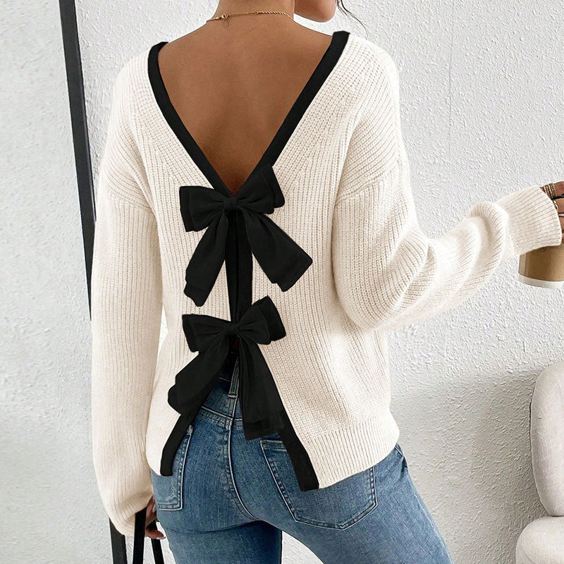 Kvinnors stickad pullover med V-hals och dekorativa rosetter runt-Eva Jonsson