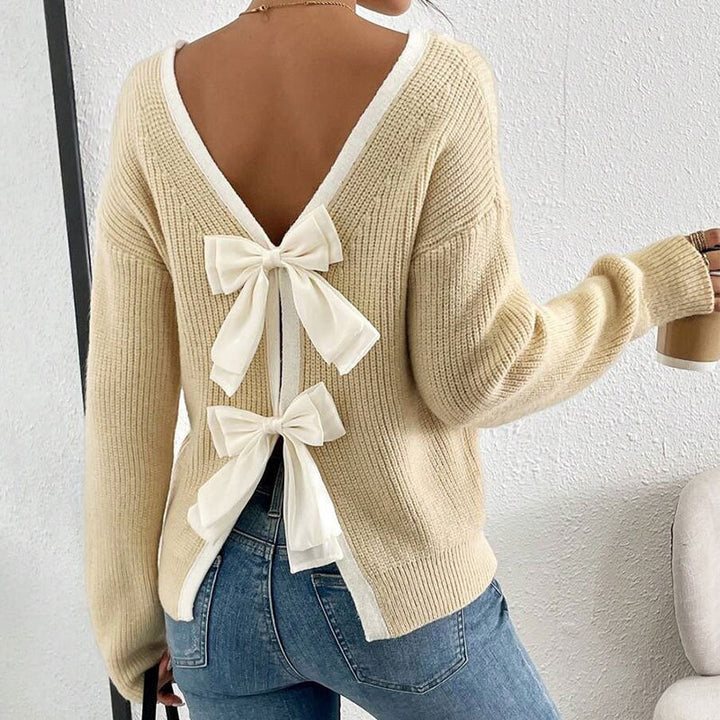 Kvinnors stickad pullover med V-hals och dekorativa rosetter runt-Eva Jonsson