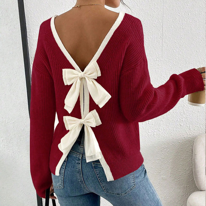 Kvinnors stickad pullover med V-hals och dekorativa rosetter runt-Eva Jonsson