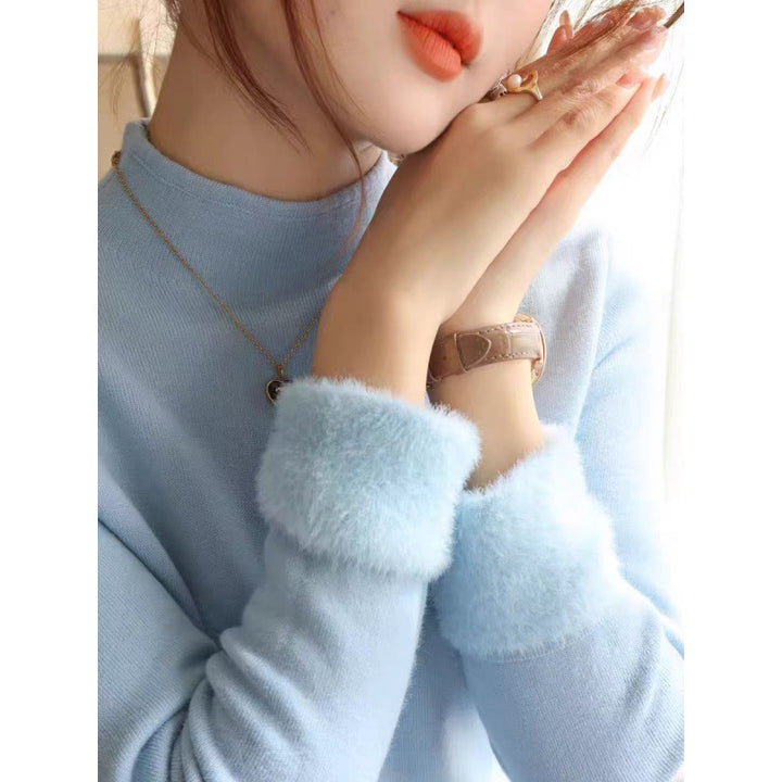 Kvinnors stickad pullover med fluffiga detaljer Mirla-Eva Jonsson