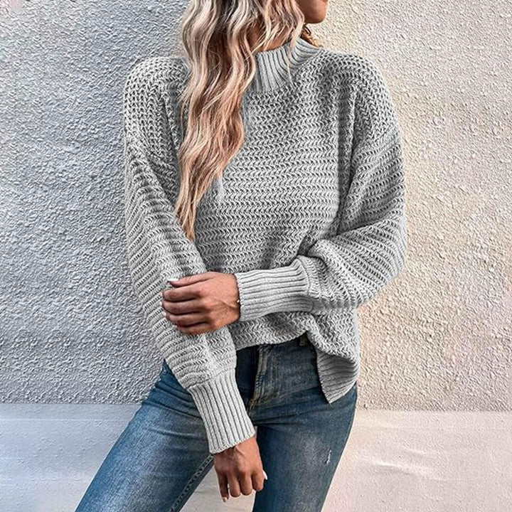 Kvinnors stickad pullover med hög krage och strukturerad stickning Mirla-Eva Jonsson